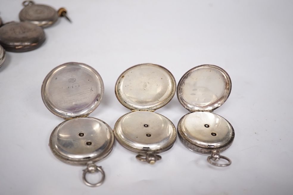 Three early to mid 20th century silver open faced pocket watches, with Roman or Arabic dials and subsidiary seconds, including two keyless and one key wind (Admiral Tacy Watch Co), together with one smaller silver open f